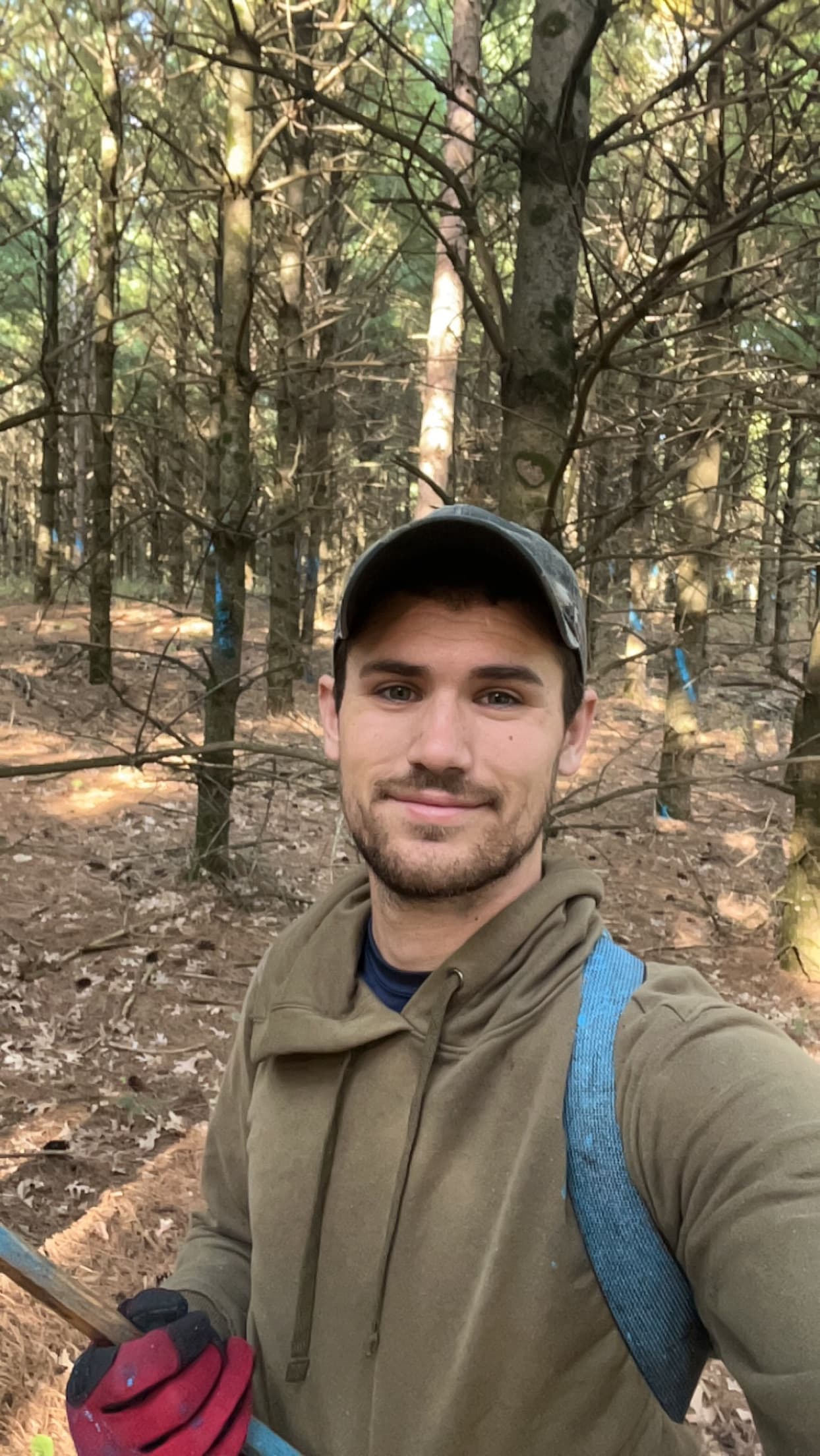 Tyler VanVonderen working in a Wisconsin woodland